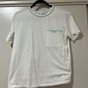 White t shirt with green stitching
